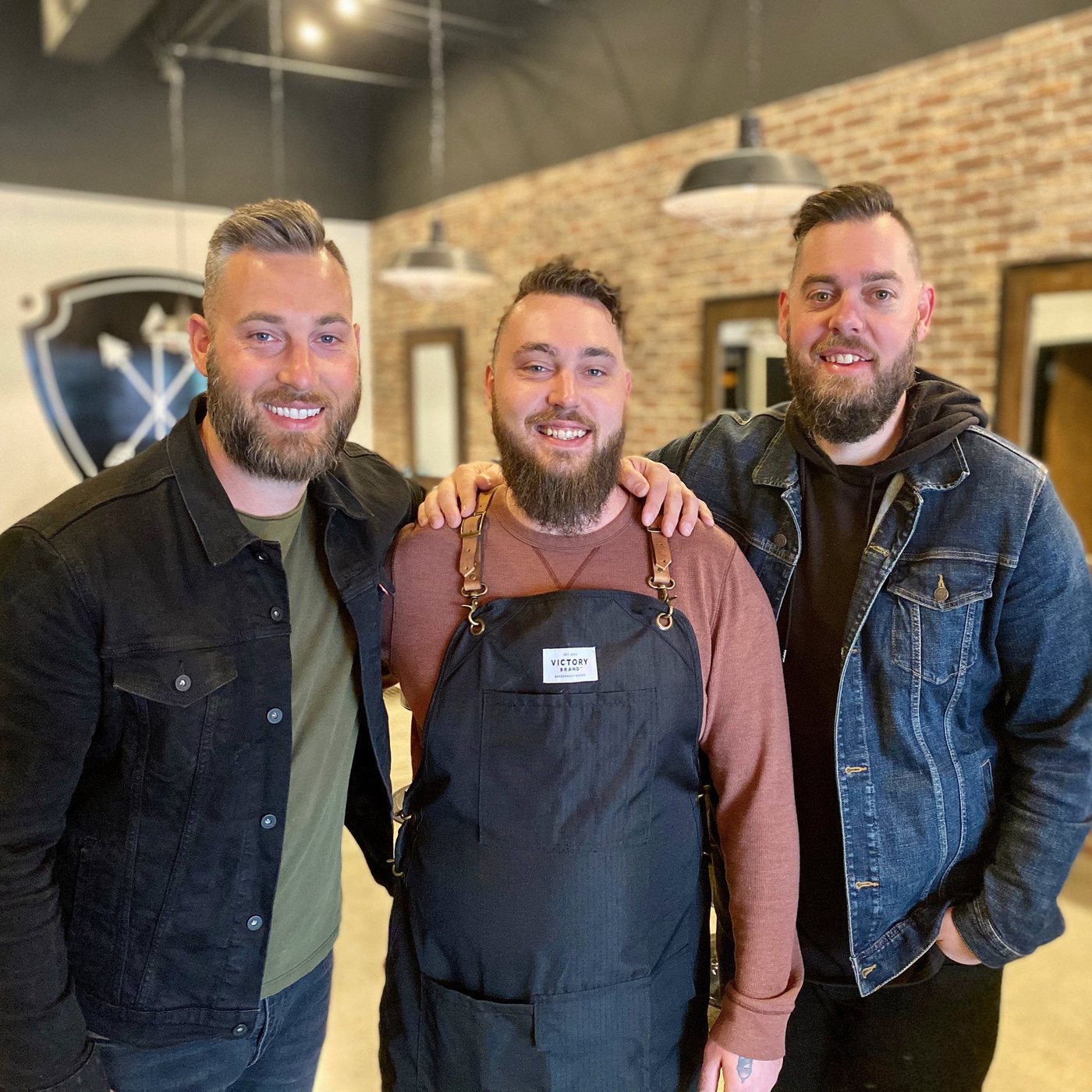 Brothers Drew, Caleb and Daniel Powell, owners of Valor3 Barbers + Brews, inside the shop in Fishers, Indiana